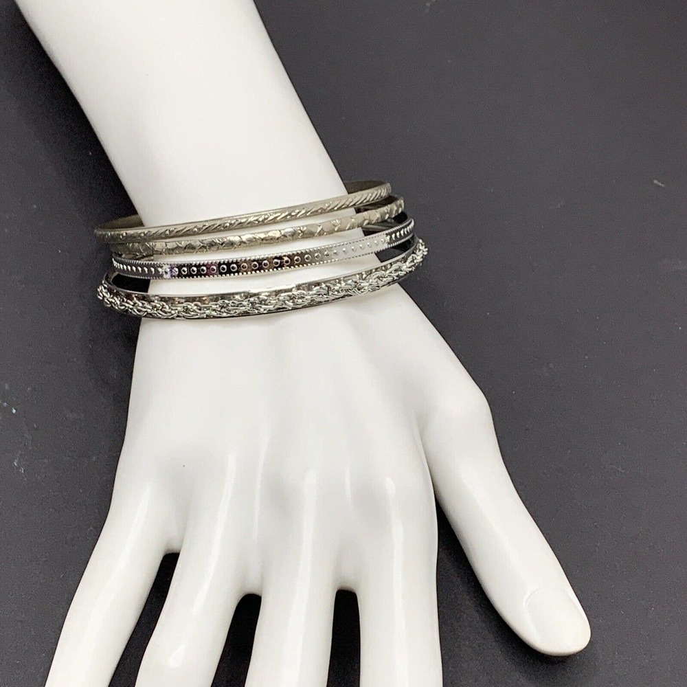 Four Silver Tone Bangles - image 2